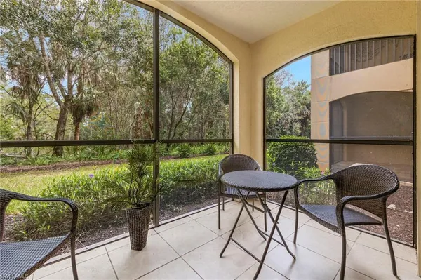 a view of a chairs and table in the patio