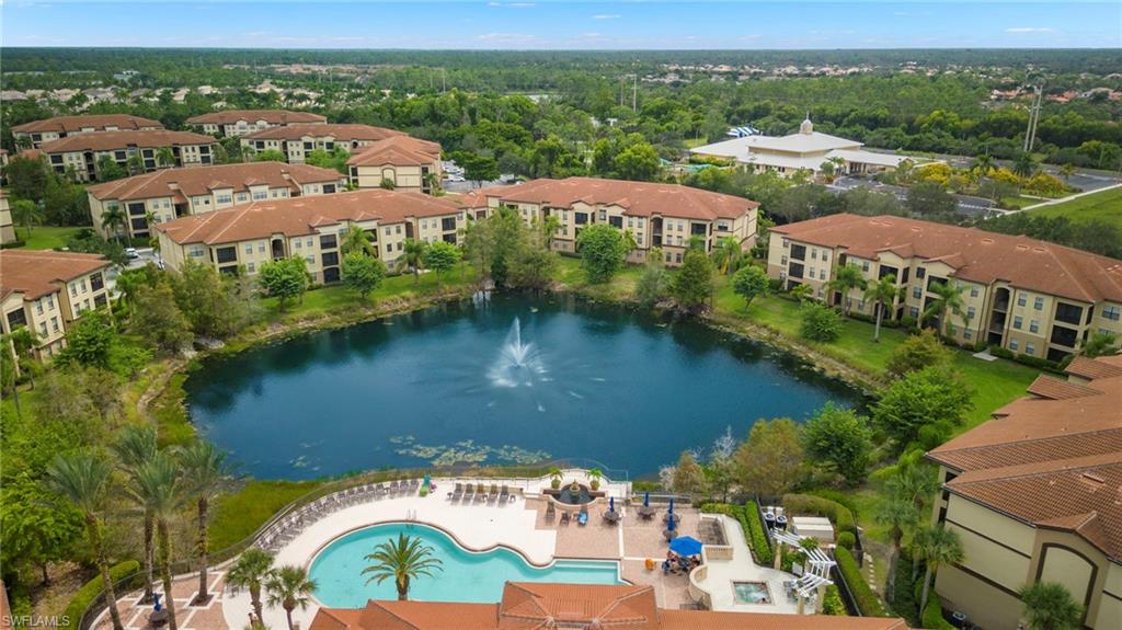 12955 Positano Circle, Unit 104 Naples, FL 34105 - Photo 24 of 40 an aerial view of lake residential houses with outdoor space and river