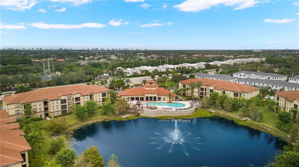 12955 Positano Circle, Unit 104 Naples, FL 34105 - Photo 26 of 40 an aerial view of residential houses with outdoor space and lake view