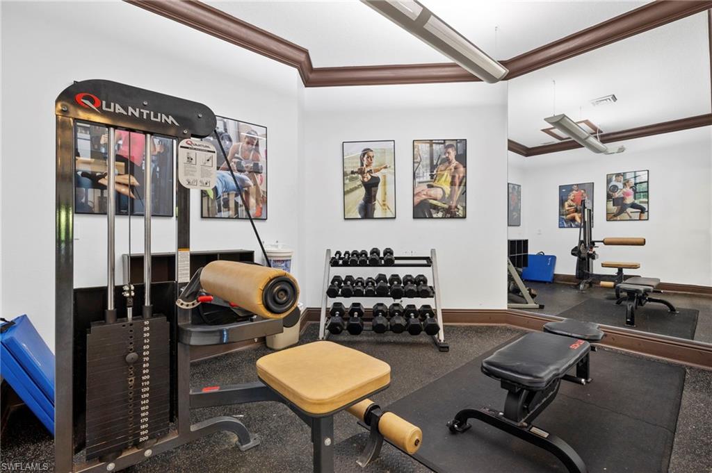 12955 Positano Circle, Unit 104 Naples, FL 34105 - Photo 34 of 40 a room with furniture and gym equipment
