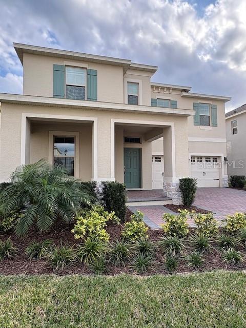 17792 Adrift Road Winter Garden, FL 34787 - Photo 1 of 1 a front view of a house with garden