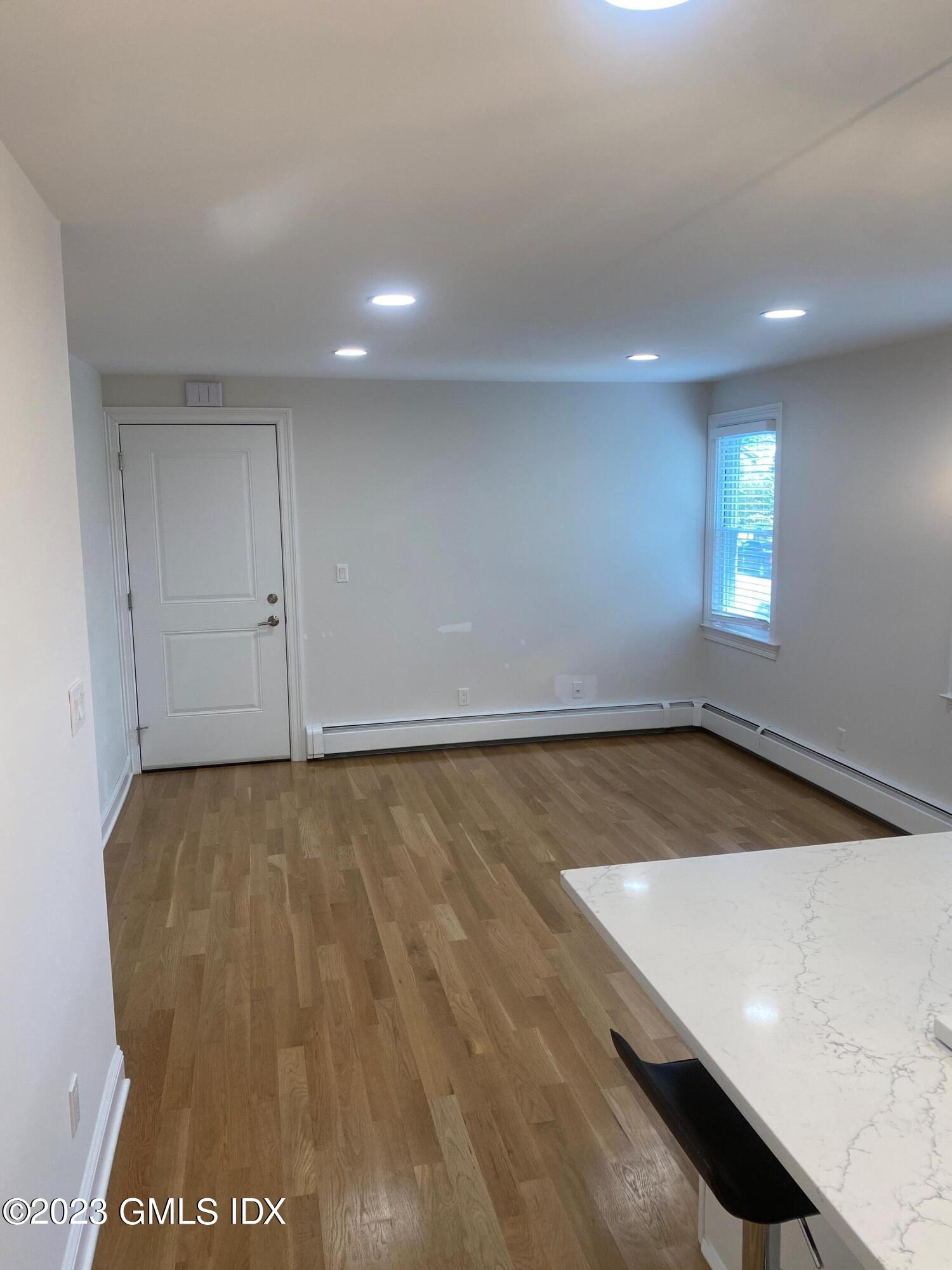 36 Arch Street, Unit 2A Greenwich, CT 06830 - Photo 3 of 7 an empty room with a window