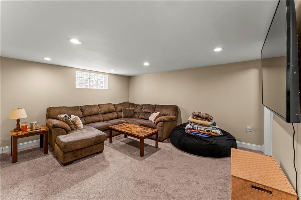 1962 Homestead Duquesne Road West Mifflin, PA 15122 - Photo 16 of 30 The finished lower level expands your living space with a huge game room, ideal for relaxing, hosting, or creating a home office or gym.