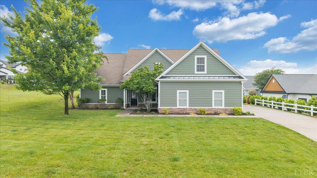 1250 Our Cove Road Huddleston, VA 24104 - Photo 1 of 70 a front view of a house with a yard