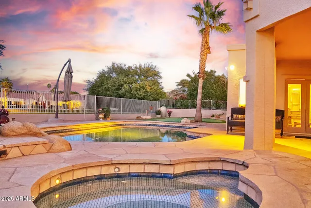 a view of a swimming pool with a lounge chair