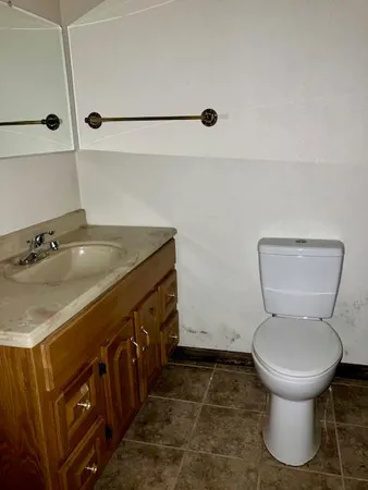 a bathroom with a toilet and a sink