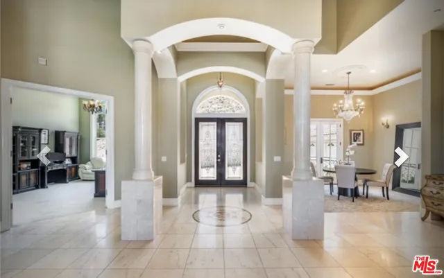 a view of a entryway door with living room