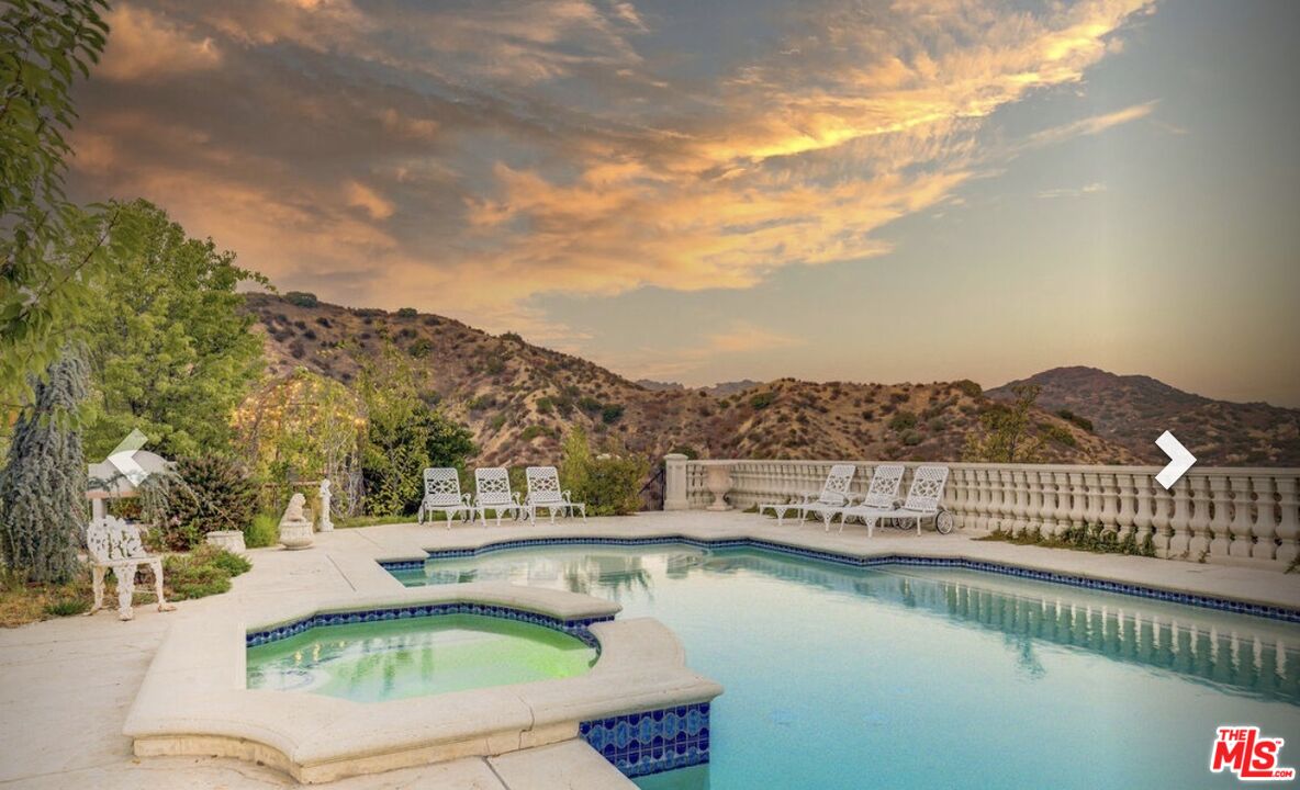 232 Saddlebow Road Bell Canyon, CA 91307 - Photo 11 of 20 a view of a swimming pool with a lake view