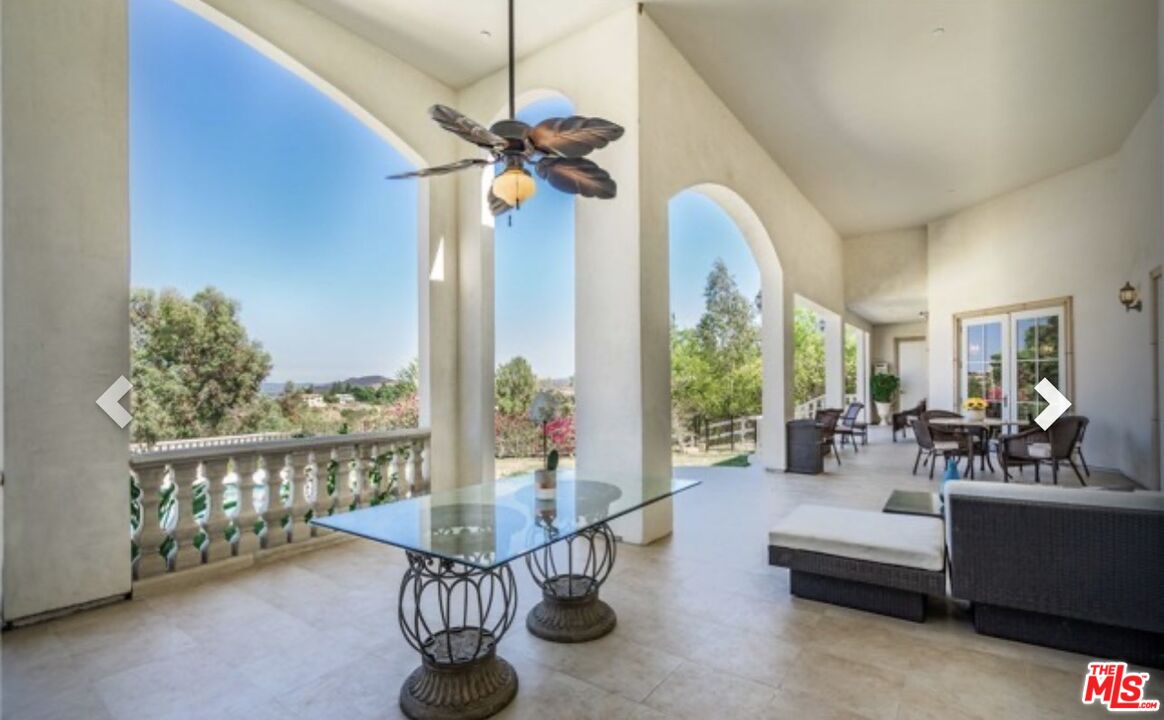 232 Saddlebow Road Bell Canyon, CA 91307 - Photo 14 of 20 a living room with furniture and a large window