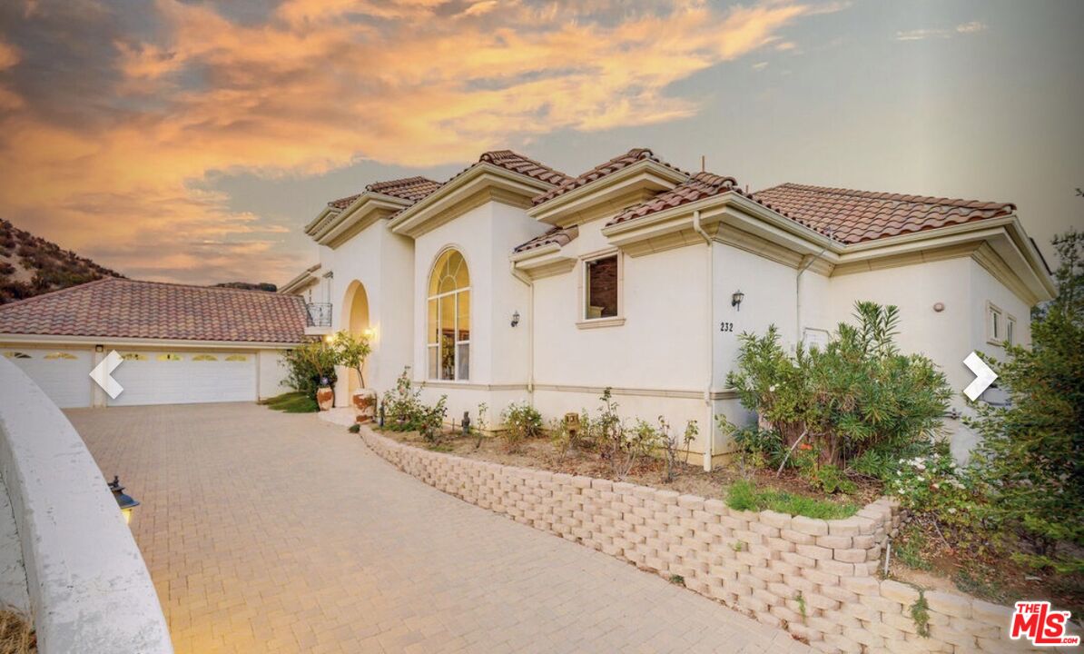 232 Saddlebow Road Bell Canyon, CA 91307 - Photo 15 of 20 a front view of a house with a yard
