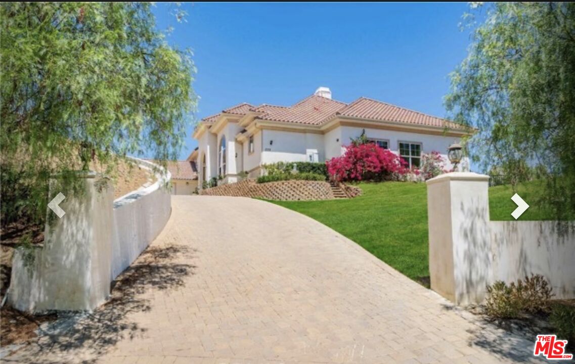 232 Saddlebow Road Bell Canyon, CA 91307 - Photo 16 of 20 a front view of a house with a yard and garage
