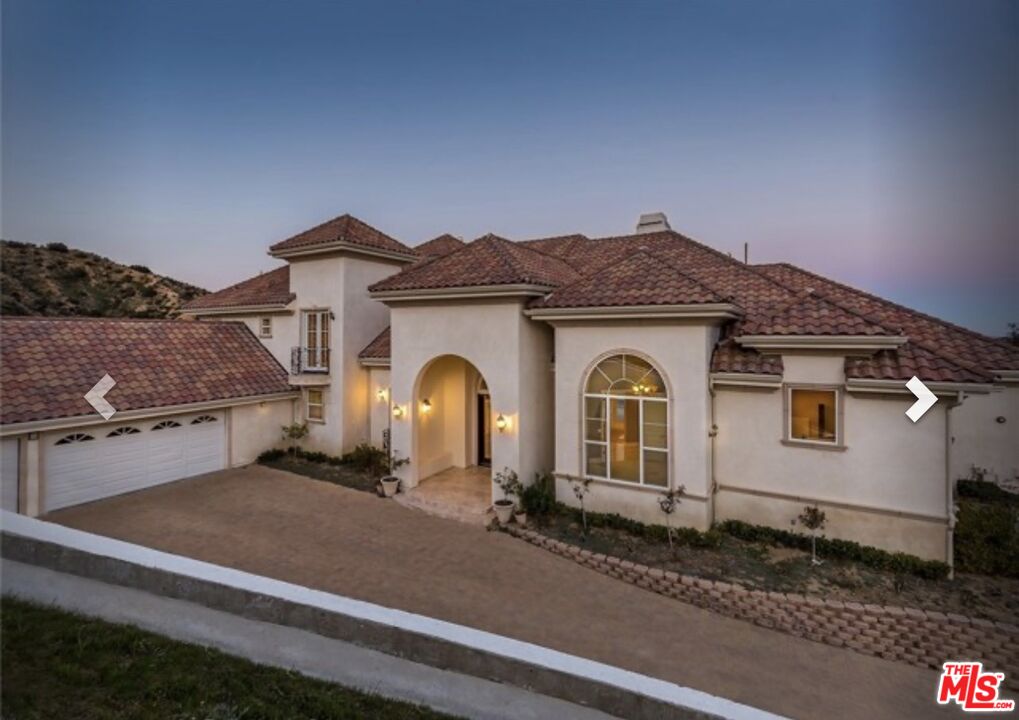 232 Saddlebow Road Bell Canyon, CA 91307 - Photo 18 of 20 a front view of a house with yard