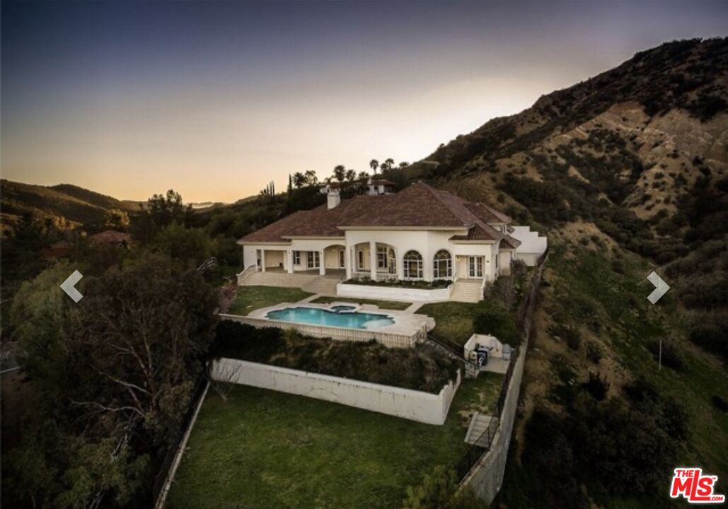 232 Saddlebow Road Bell Canyon, CA 91307 - Photo 20 of 20 a front view of a house with a garden