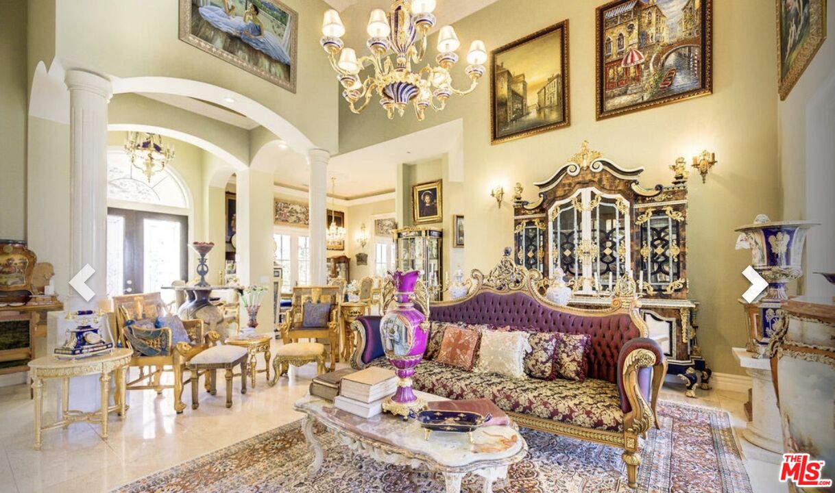 232 Saddlebow Road Bell Canyon, CA 91307 - Photo 2 of 20 a living room with furniture and a chandelier