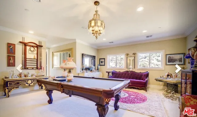 a living room with furniture a window and a table
