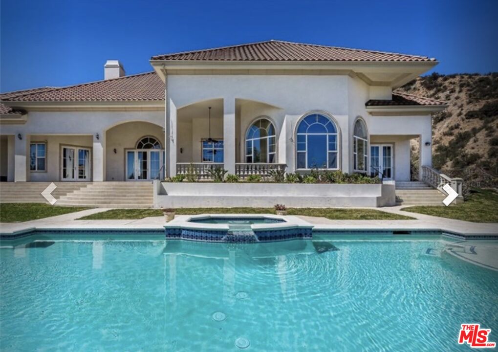 232 Saddlebow Road Bell Canyon, CA 91307 - Photo 9 of 20 a view of a house with swimming pool and a yard