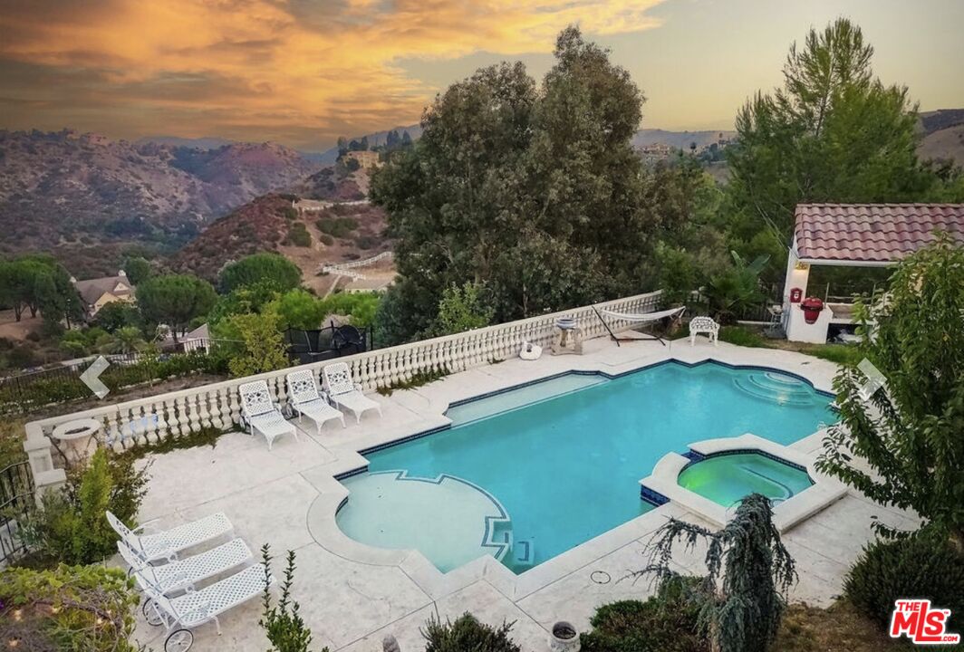 232 Saddlebow Road Bell Canyon, CA 91307 - Photo 10 of 20 a view of a chairs and table in the terrace