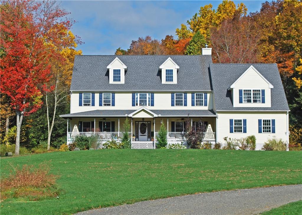 1092 Roxbury Road Southbury, CT 06488 - Photo 1 of 1 a front view of a house with a yard table and chairs