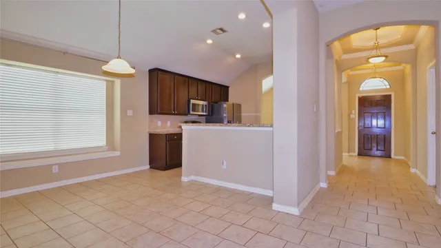 a view of a kitchen with a sink and a window