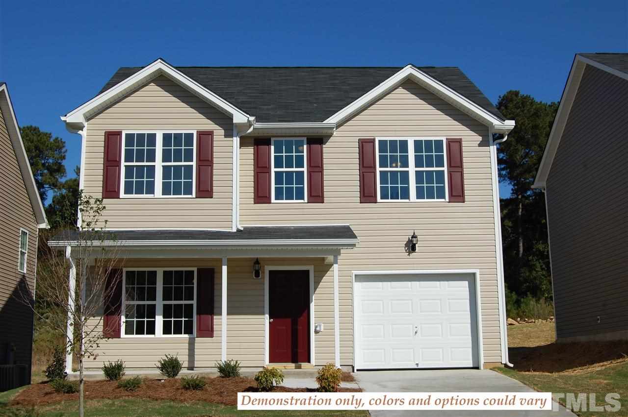 6835 Spanglers Spring Way Raleigh, NC 27610 - Photo 1 of 10 a front view of a house with a yard