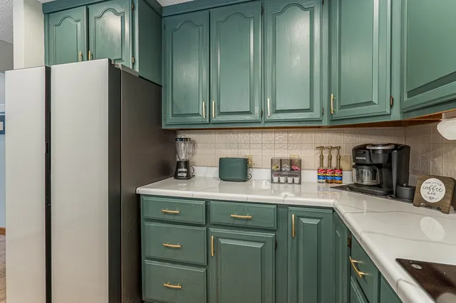 a utility room with sink dryer and washer