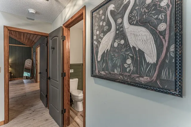 a bedroom with a bed and a fireplace