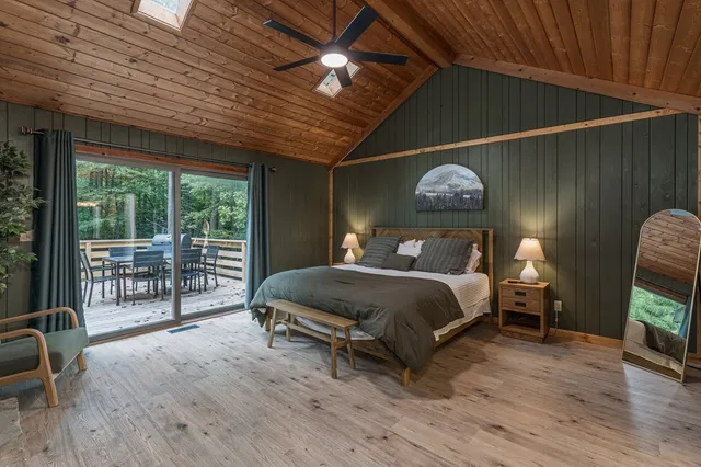 a white toilet sitting next to a shower curtain