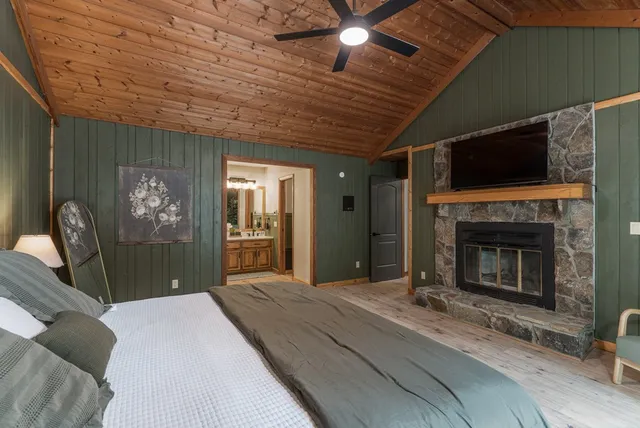 a view of a hallway with wooden floor and entryway