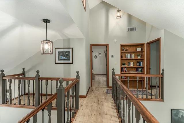 a bedroom with a bed and a television