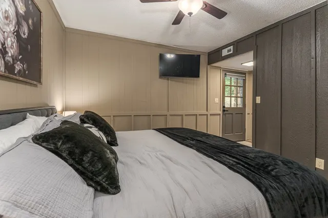 a view of a lush green forest with lots of trees