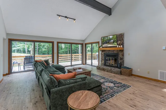 a living room with furniture and a rug