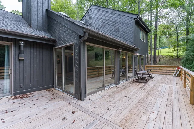 a view of a dining room with furniture wooden floor and chandelier