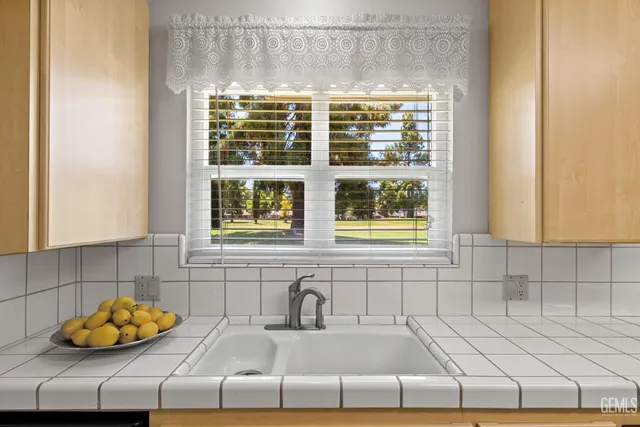 a bathroom with a sink and a window