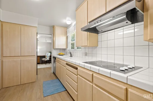 a kitchen with a sink and cabinets