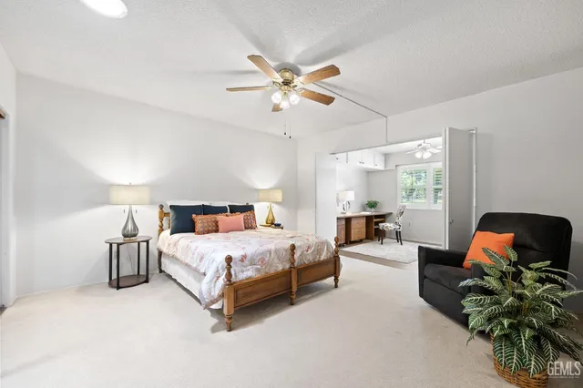 a bed room with a bed and a chandelier