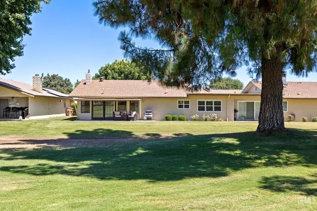 a front view of a house with a garden and porch