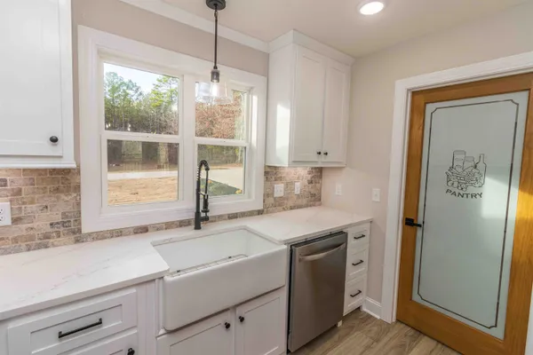 a kitchen with a sink and a window