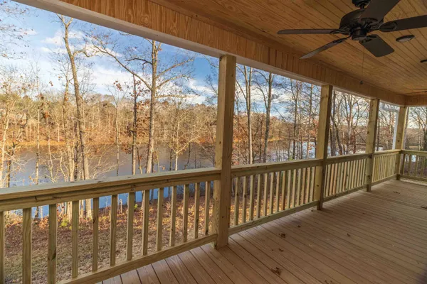 a view of a balcony with wooden floor