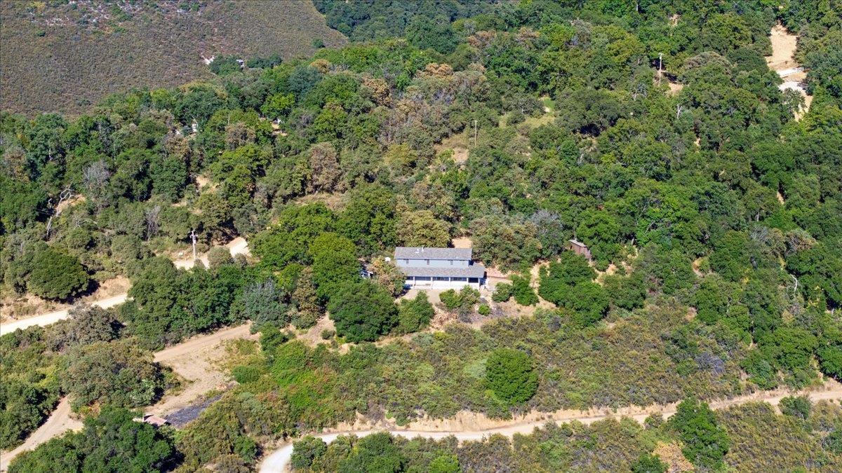 40101 Tassajara Road Carmel Valley, CA 93924 - Photo 16 of 91 an aerial view of residential house with outdoor space and trees all around