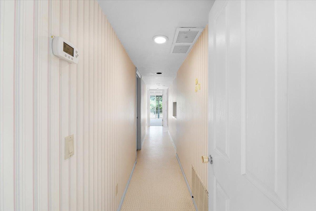 40101 Tassajara Road Carmel Valley, CA 93924 - Photo 19 of 91 a view of a hallway with wooden floor and entryway