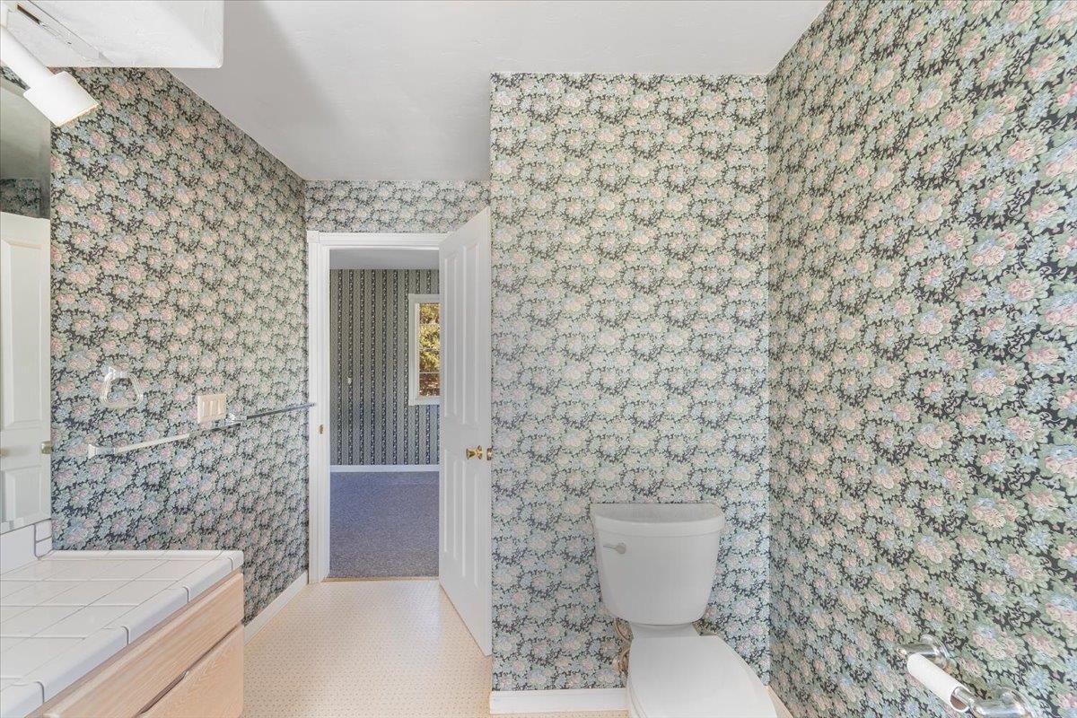 40101 Tassajara Road Carmel Valley, CA 93924 - Photo 31 of 91 a bathroom with a toilet and a sink