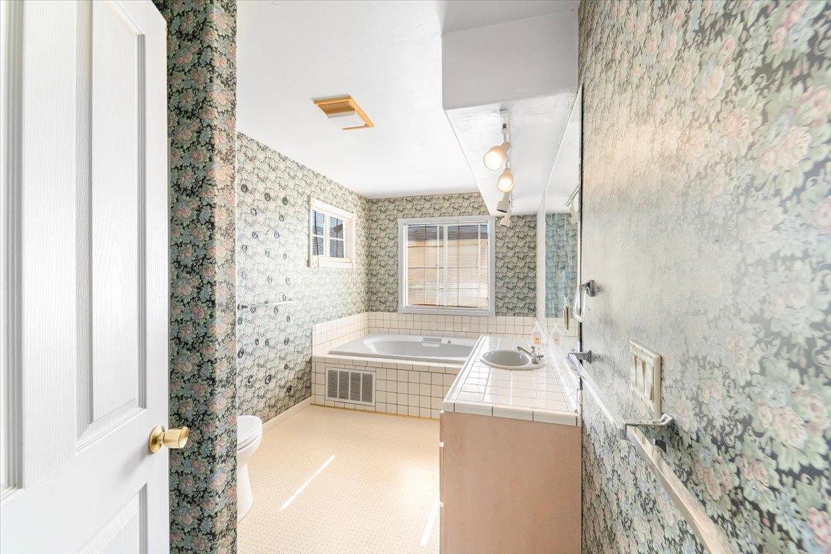 40101 Tassajara Road Carmel Valley, CA 93924 - Photo 34 of 91 a bath room with a sink and a bath tub