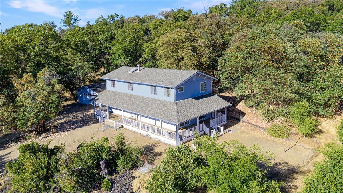40101 Tassajara Road Carmel Valley, CA 93924 - Photo 5 of 91 an aerial view of a house with yard and trees in the background