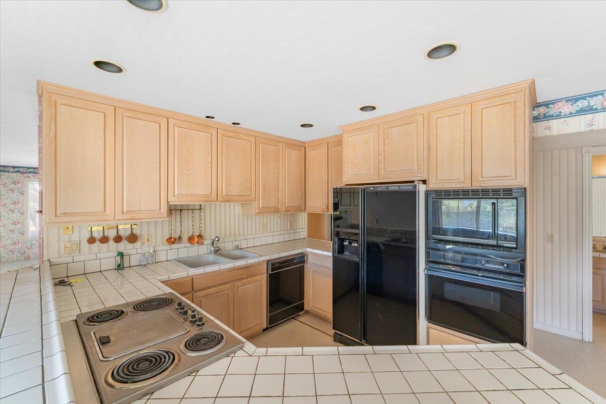 40101 Tassajara Road Carmel Valley, CA 93924 - Photo 57 of 91 a kitchen with a sink appliances and cabinets