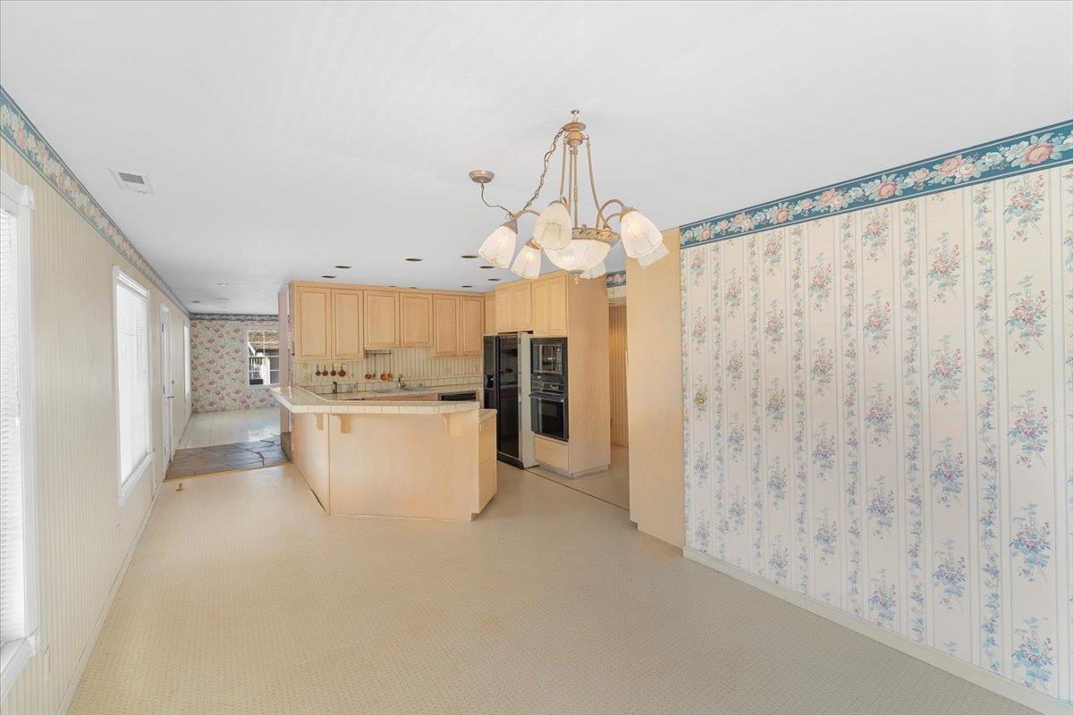 40101 Tassajara Road Carmel Valley, CA 93924 - Photo 59 of 91 a view of a kitchen with microwave and refrigerator