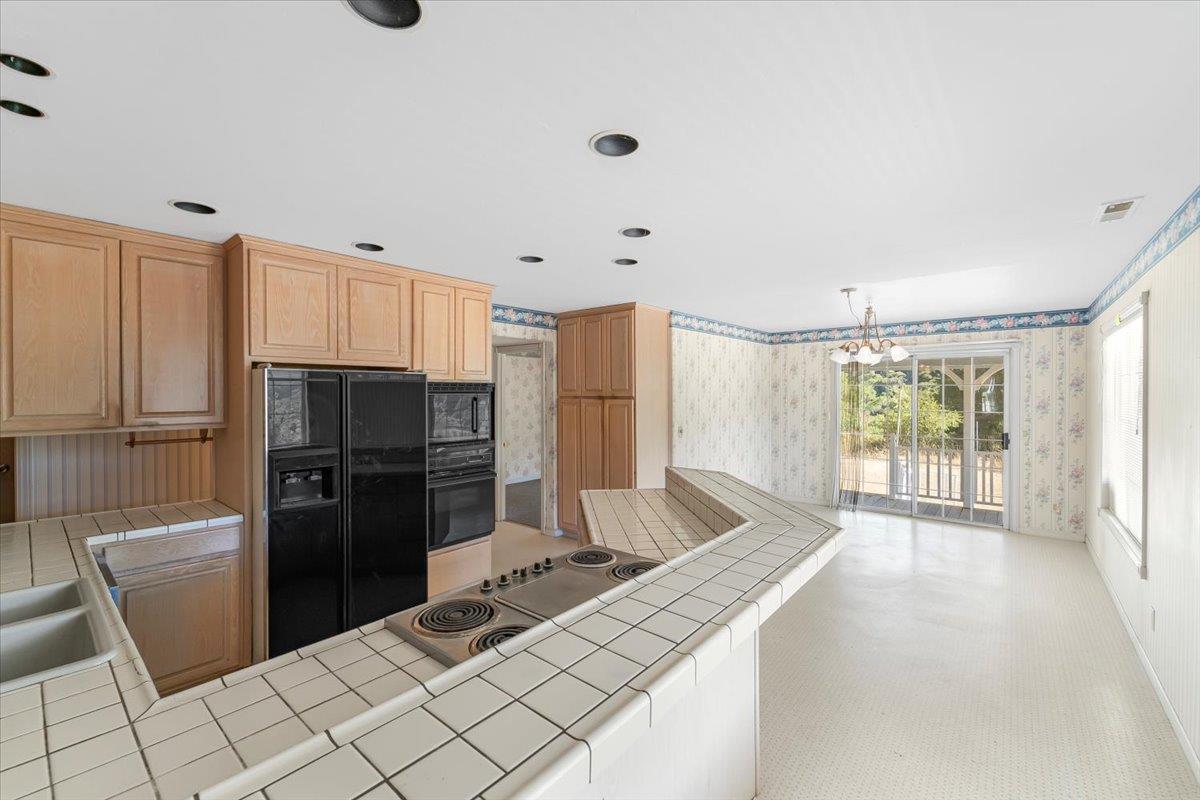 40101 Tassajara Road Carmel Valley, CA 93924 - Photo 60 of 91 a kitchen with stainless steel appliances a refrigerator and a sink