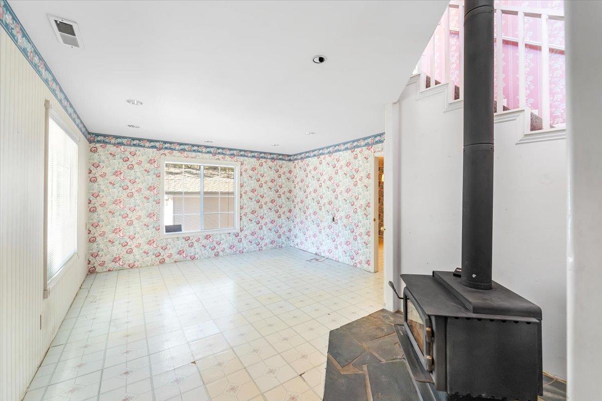 40101 Tassajara Road Carmel Valley, CA 93924 - Photo 64 of 91 a view of an empty room with a fireplace