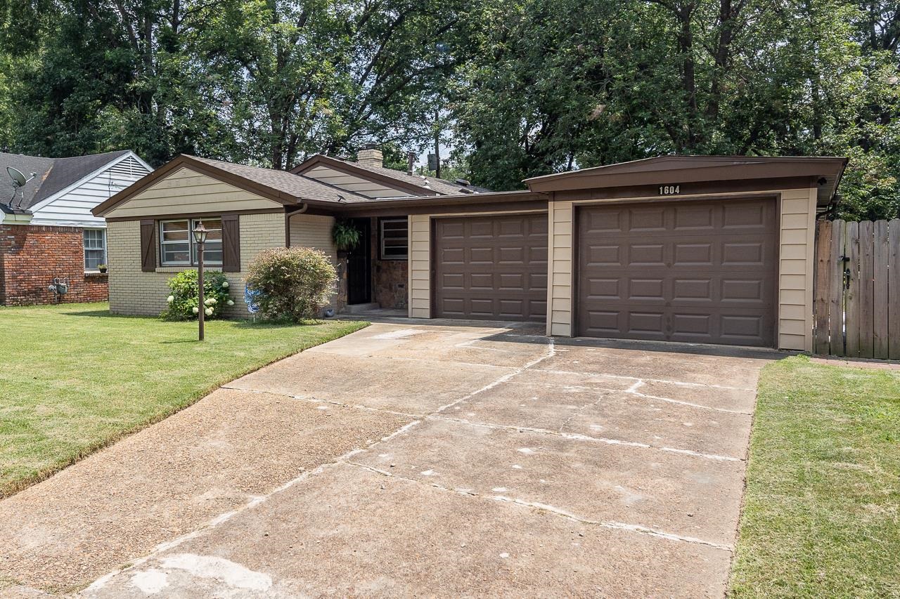 1604 Wilbec Road Memphis, TN 38117 - Photo 1 of 30 a front view of a house with a yard and garage