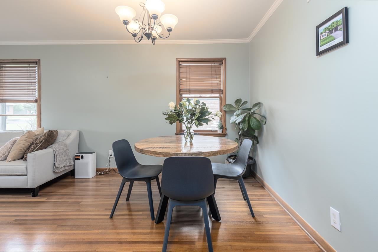 1604 Wilbec Road Memphis, TN 38117 - Photo 5 of 30 a view of a dining room with furniture wooden floor and a chandelier