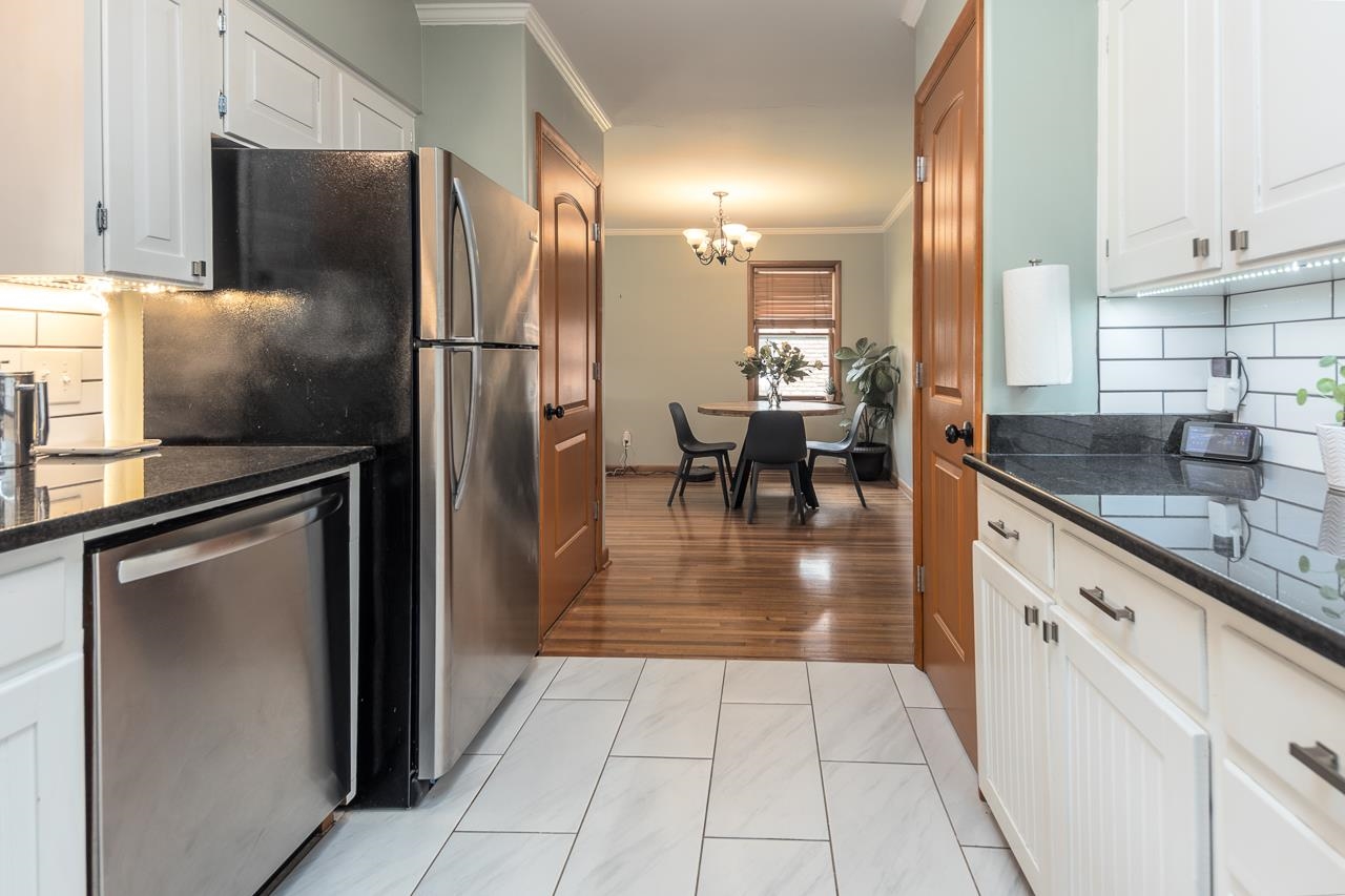 1604 Wilbec Road Memphis, TN 38117 - Photo 8 of 30 a kitchen with stainless steel appliances granite countertop a refrigerator a stove and a sink